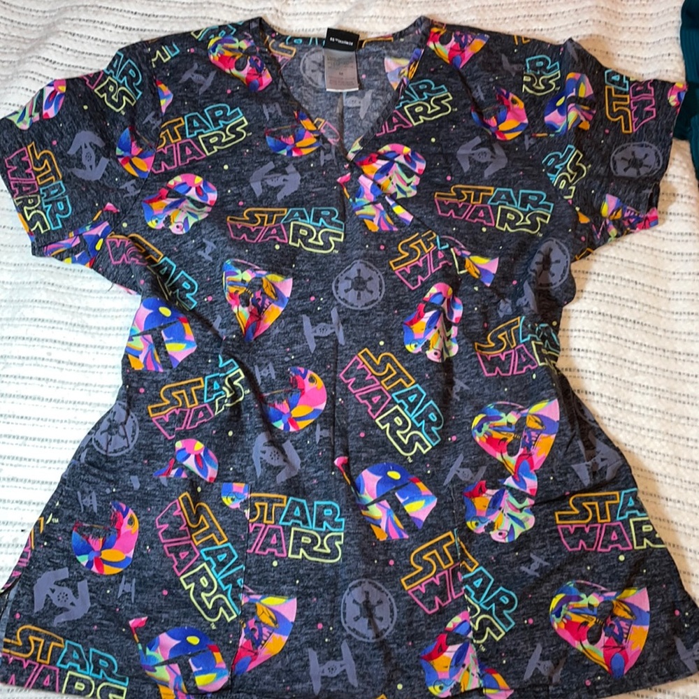 NWOT Rare hard to find grey and colorful Star Wars scrub top. Size medium.
